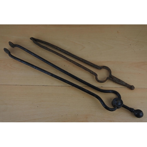 233 - Two vintage fire tongs.