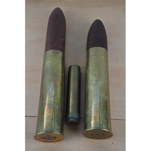 236 - A pair of antique brass shells and another.