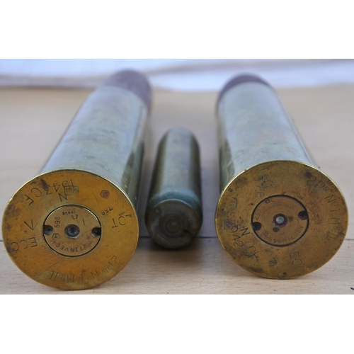 236 - A pair of antique brass shells and another.