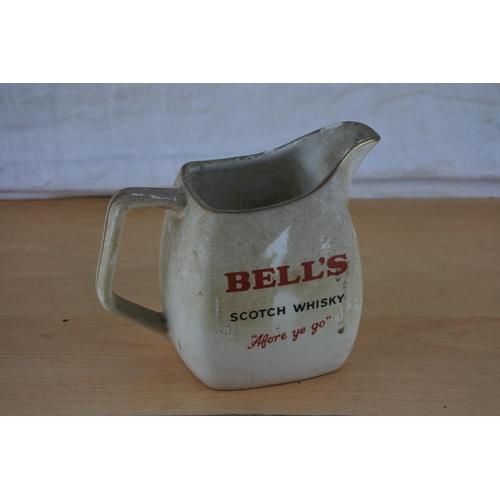 240 - A vintage Bell's Scotch Whiskey jug.