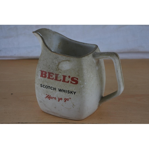 240 - A vintage Bell's Scotch Whiskey jug.