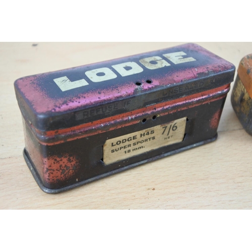 241 - A vintage KLG tin box with spark plug and another Lodge tin box.