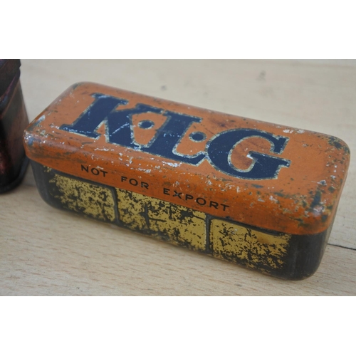 241 - A vintage KLG tin box with spark plug and another Lodge tin box.