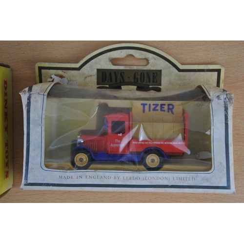 247 - Two boxed Day Gone trucks and a boxed Dinky Toys Esso petrol pumps.