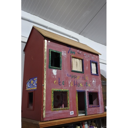 250 - A large handmade dolls house. Approx 80x72cm.