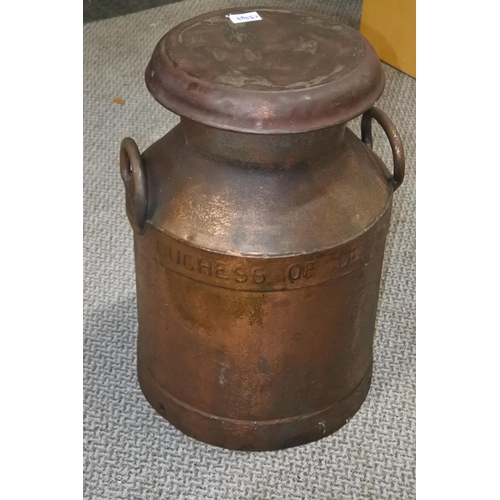 252 - A stunning antique copper milk can . Approx 49cm tall.