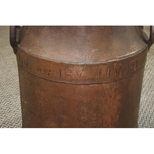 252 - A stunning antique copper milk can . Approx 49cm tall.