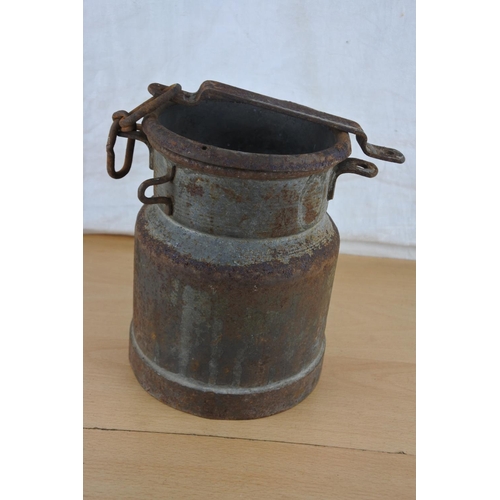 255 - An unusual antique small milk pail with chain. Approx 20cm.