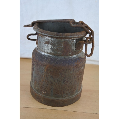 255 - An unusual antique small milk pail with chain. Approx 20cm.