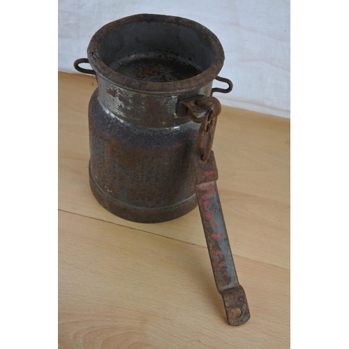 255 - An unusual antique small milk pail with chain. Approx 20cm.