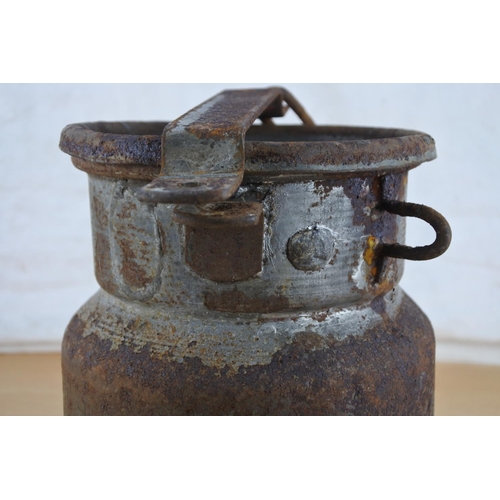 255 - An unusual antique small milk pail with chain. Approx 20cm.