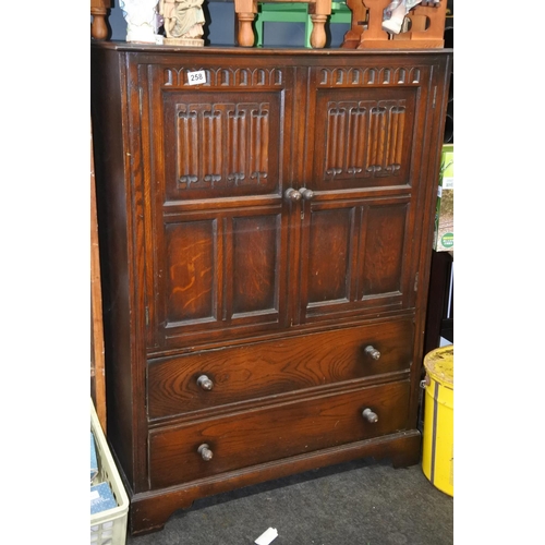 258 - An Old Charm two door storage cabinet  with drawers. Approx 117x84cm.