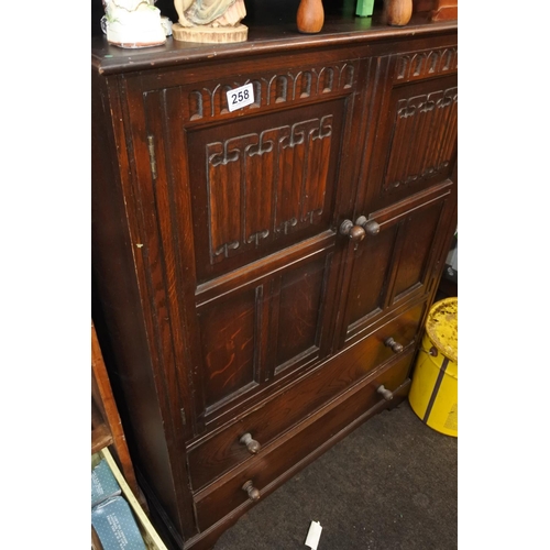 258 - An Old Charm two door storage cabinet  with drawers. Approx 117x84cm.