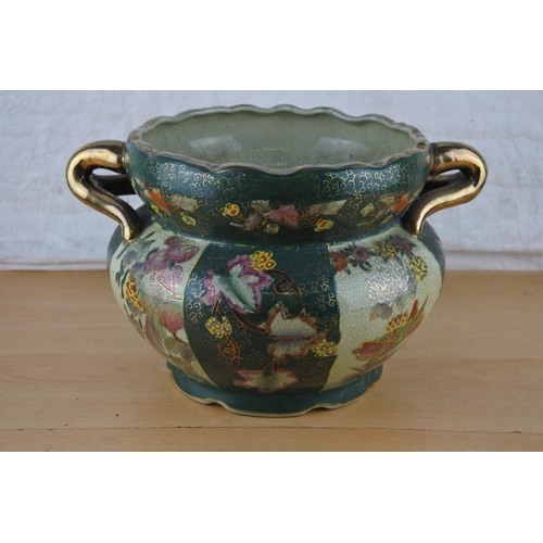 261 - A ceramic and gilt flower pot.