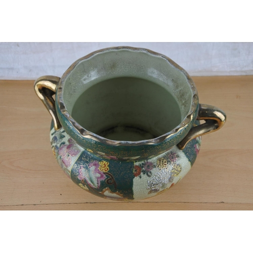 261 - A ceramic and gilt flower pot.