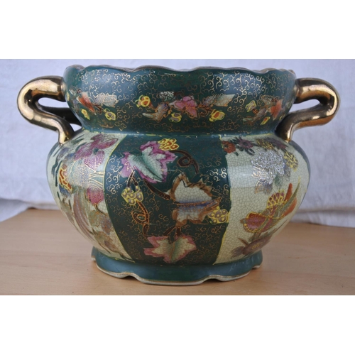 261 - A ceramic and gilt flower pot.