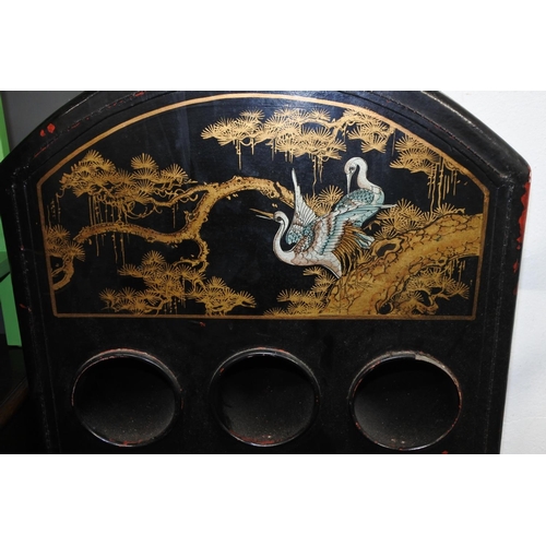 265 - A stunning wooden cased 12 bottle wine rack with oriental design. Approx 81x41cm.