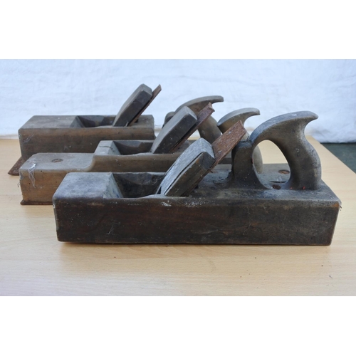 290 - Three large antique wood planes.