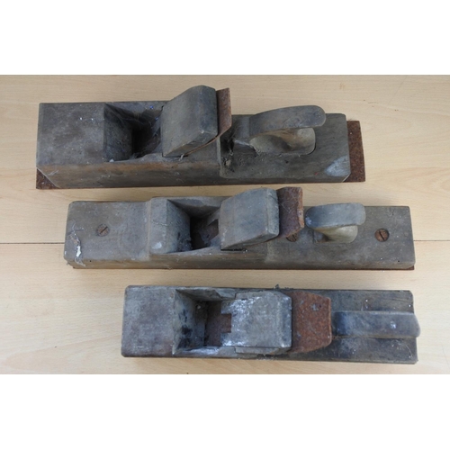 290 - Three large antique wood planes.