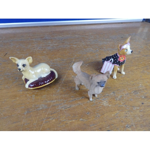 304 - A Beswick pottery dog and two others.