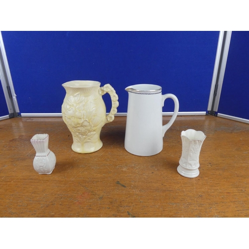 309 - A vintage Arthur Wood pottery jug, an antique Dun Bennett pottery jug, and two Belleek pottery small... 