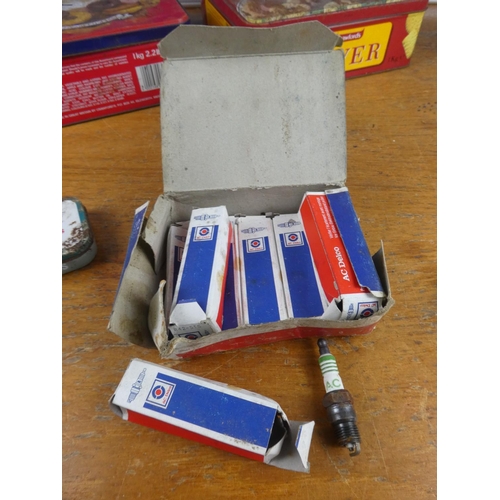 316 - Two vintage Rover tins, a vintage Lister bottle top, boxed AcDelco spark plugs, oil cans and more.