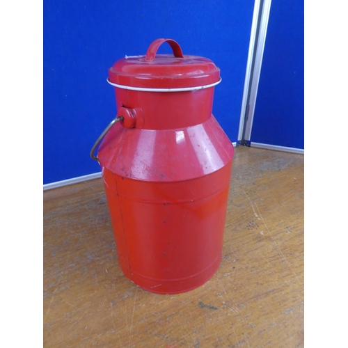 320 - A lidded milk can. Approx 34cm tall.