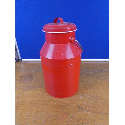 320 - A lidded milk can. Approx 34cm tall.