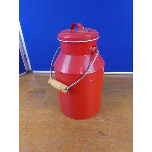 320 - A lidded milk can. Approx 34cm tall.