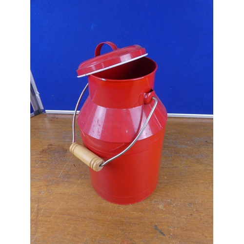 320 - A lidded milk can. Approx 34cm tall.