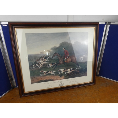 324 - A framed picture of a hunting scene. Approx 52x64cm.