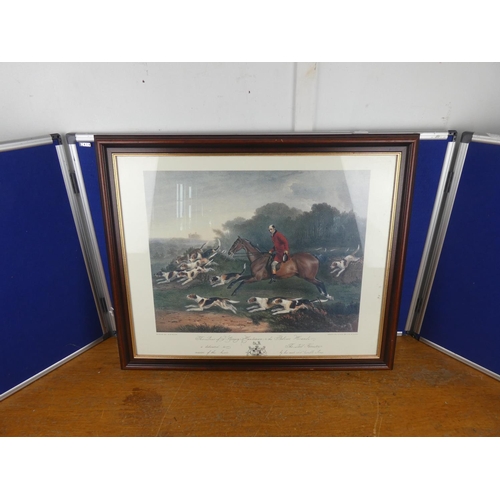 324 - A framed picture of a hunting scene. Approx 52x64cm.