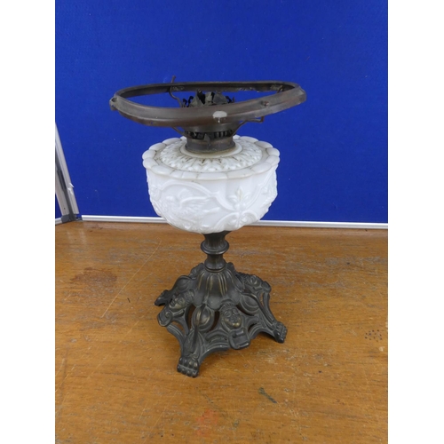 334 - A stunning antique oil lamp base with milk glass font decorated with birds. Approx 37cm.