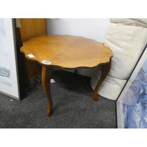 340 - A vintage scalloped edge coffee table.