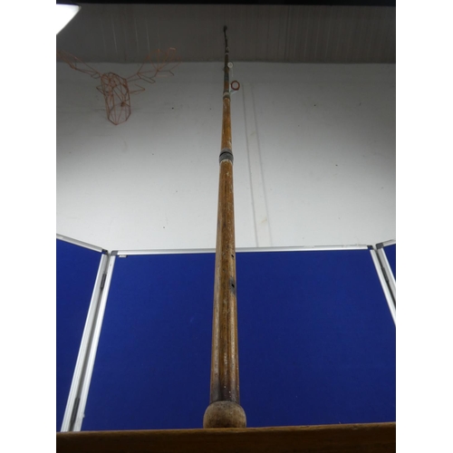 362 - A wooden fishing rod.