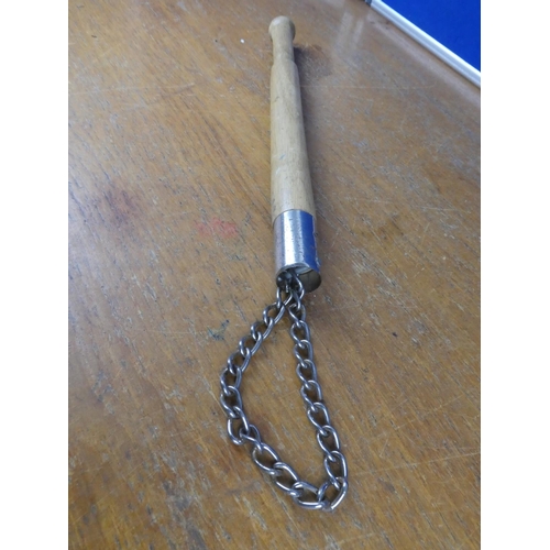 372 - A wooden baton and chain.