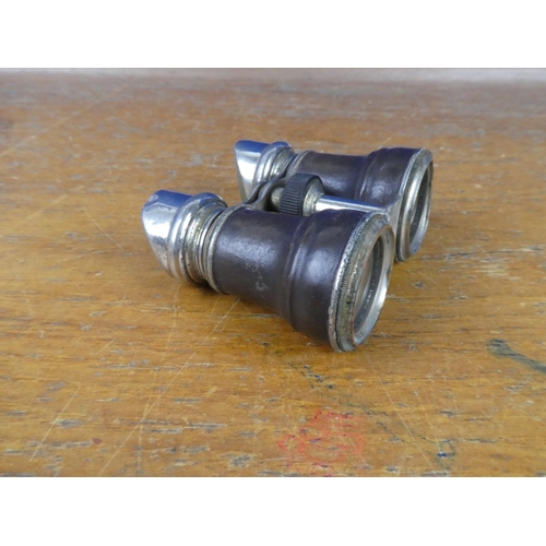 378 - A pair of vintage field glasses/ binoculars.