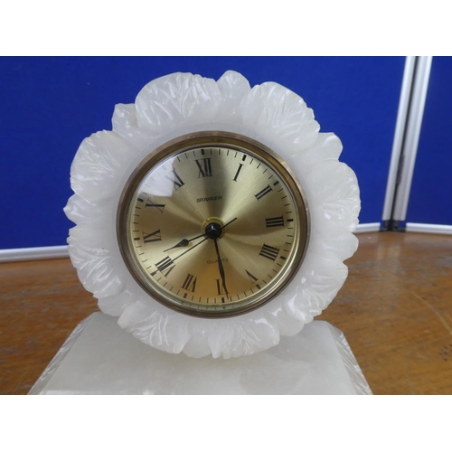 382 - A vintage Stagier Quartz onyx cased mantle clock on brass feet.