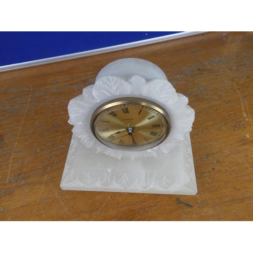 382 - A vintage Stagier Quartz onyx cased mantle clock on brass feet.