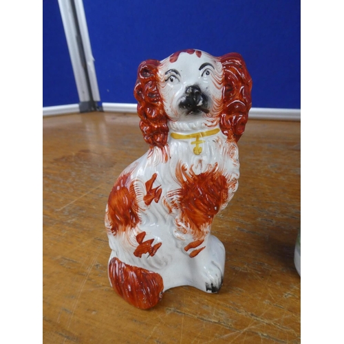 385 - Two antique Staffordshire figures and an ornament of a dog.