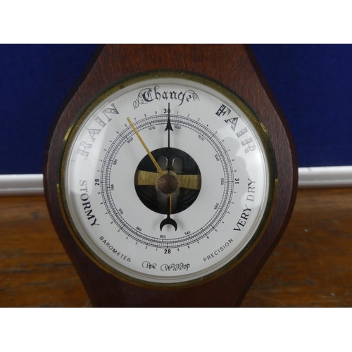 389 - A small mahogany wall mounted barometer.