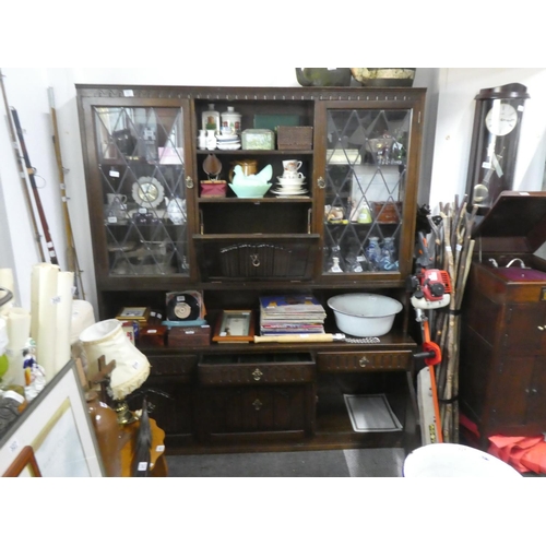 391 - An oak leaded glass display cabinet.