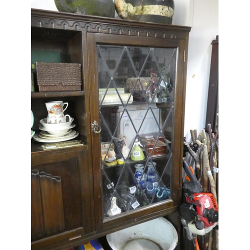 391 - An oak leaded glass display cabinet.