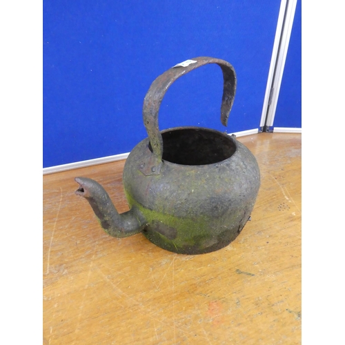 394 - An antique kettle.