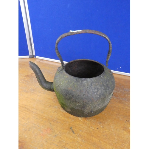 394 - An antique kettle.