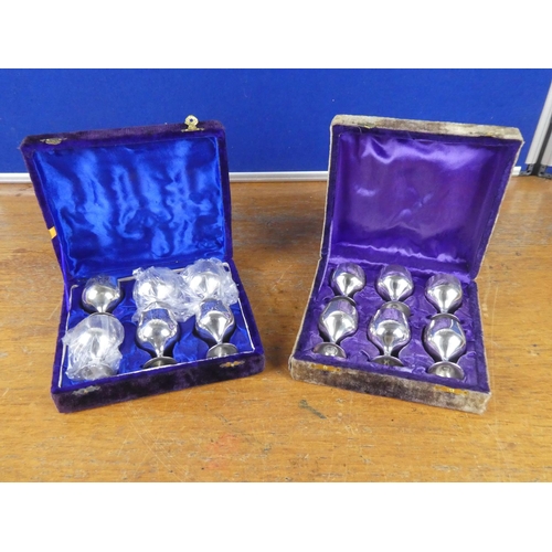 397 - Two vintage boxed set of silver plated small liquor goblets.