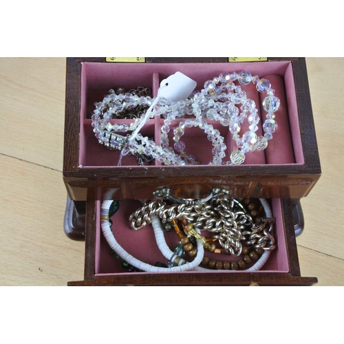 404 - A wooden jewellery box and contents