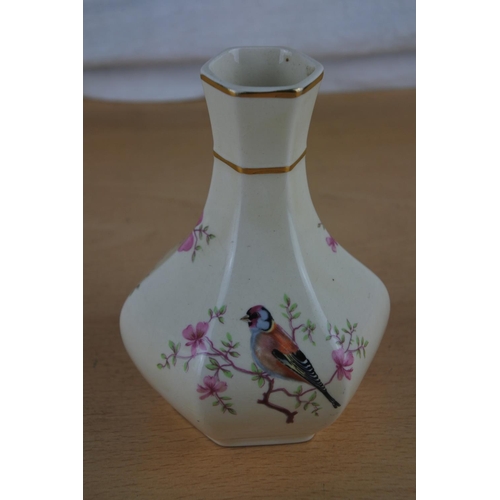 409 - A small Royal Worcester 'Palissy' vase.