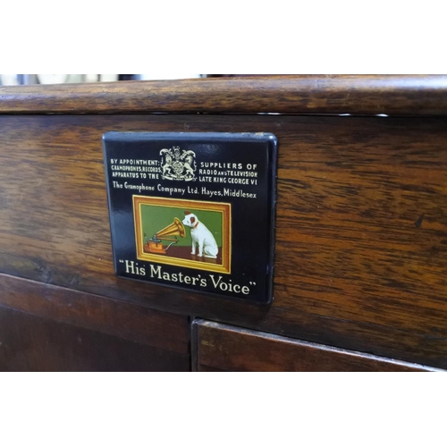 414 - A mahogany cased 'His Master's Voice' gramophone (a/f) with a box of various gramophone parts. Appro... 