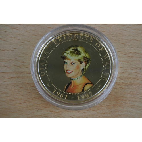 425 - A cased One Dollar 'Lady Diana' coin and another.